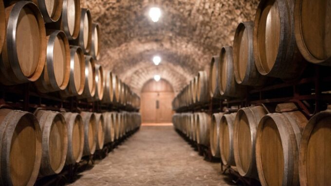 A row of wine barrels at a winery.