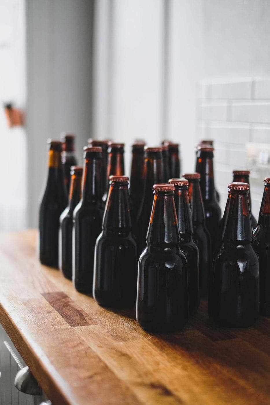 Glass bottles on wooden shelf